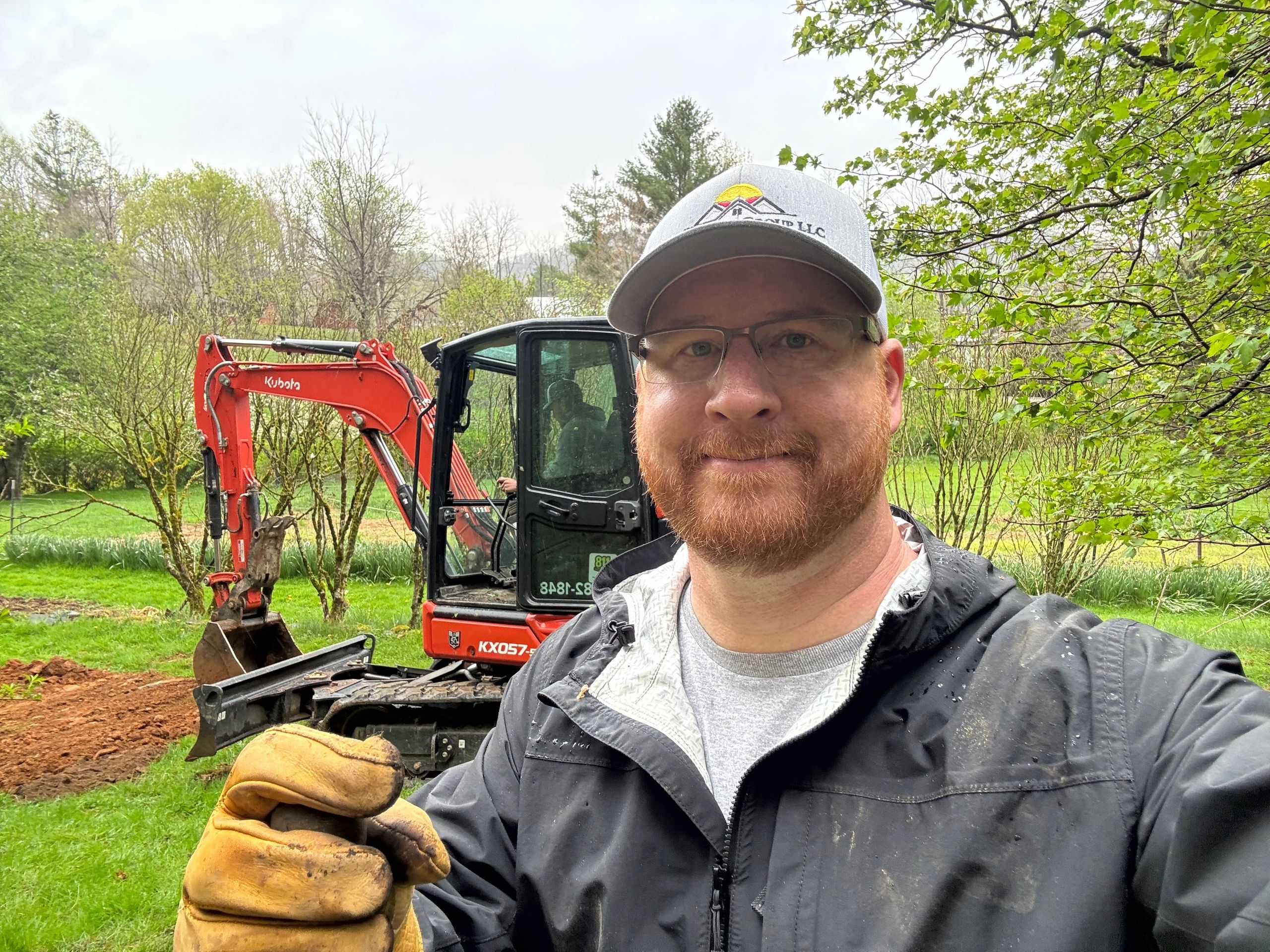 Riverfront Group owner Adam Grabousky on a job site with a Kubota mini-excavator