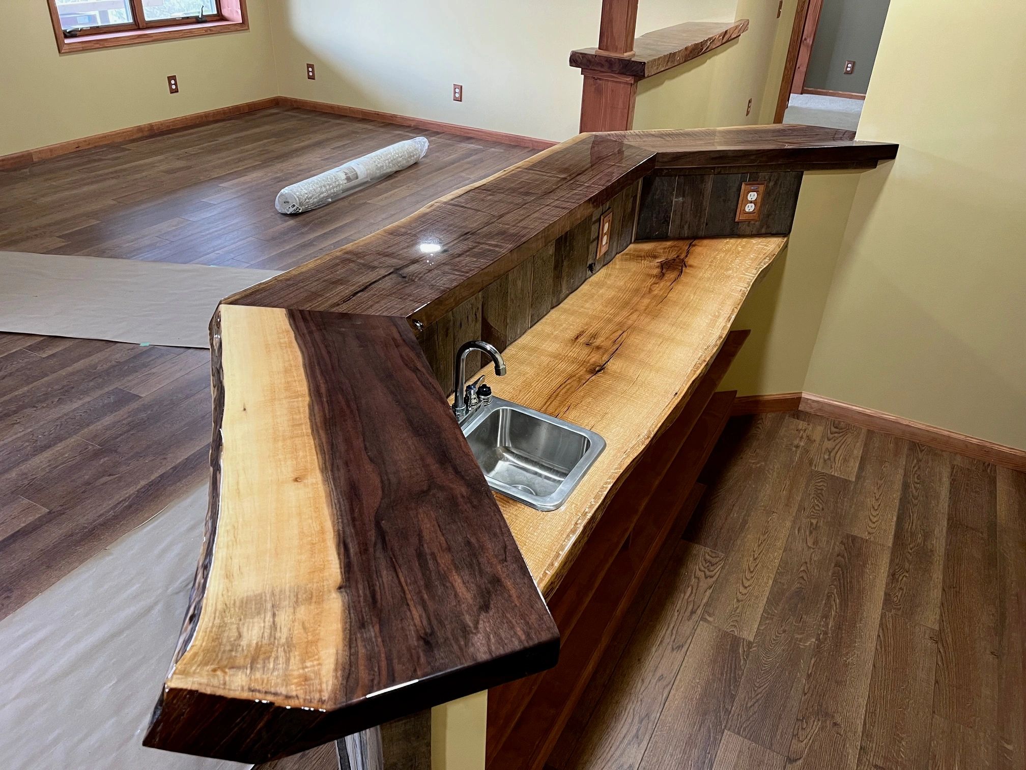 Live-edge wood bar and countertop with sink, custom woodwork